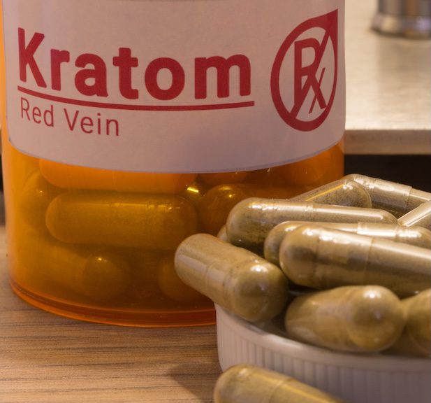 Kratom pills on a desk
